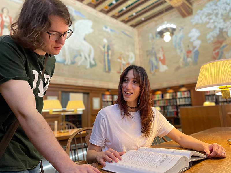 Sophie and Luke Linn Henley studying together.