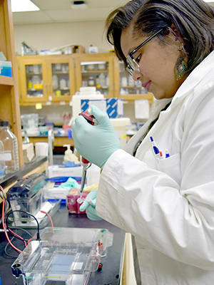 CPCTP alum Kendra Royston, PhD, works in the lab.