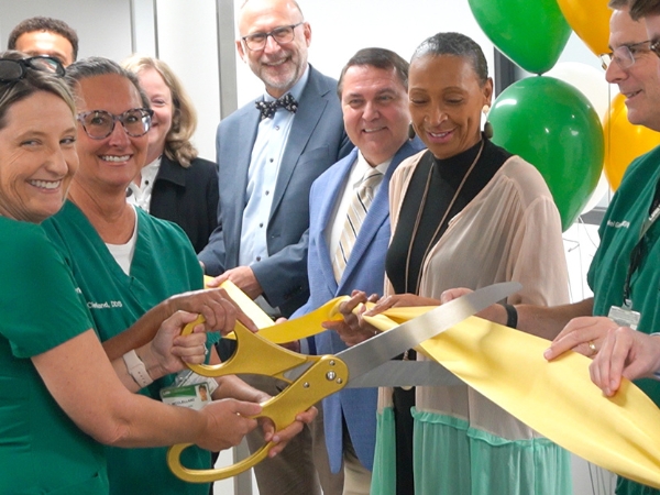 Dr. Wadiak and Dr. McClelland cutting the ribbon