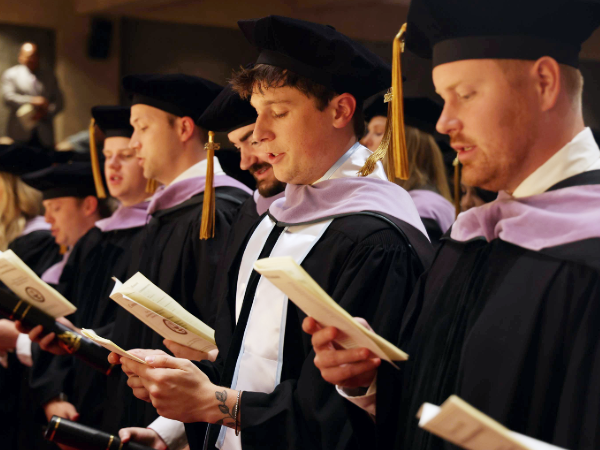 Graduating dental students reciting the dentists pledge