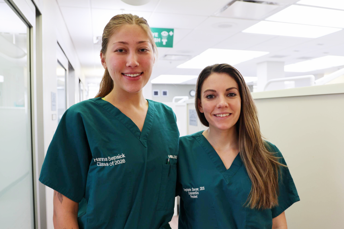 Hanna Sepsick and Dr. Sawyer smiling for photo in clinic