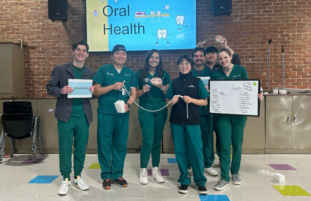 Pictured (L-R): Students Luke Denton, Enkhee Ganbataar, Emily Joy, Dr. Yu-Yin Lin, Alex Pausa, Jungwoo Kim, and Lauren Hayes during an Operation Toothbrush presentation.
