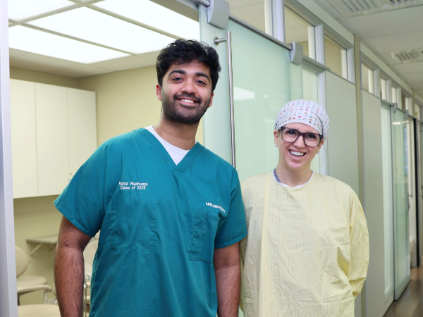 Rahul and Wadhwani and Dr. Geisinger standing together in the Perio clinic at UAB School of Dentistry
