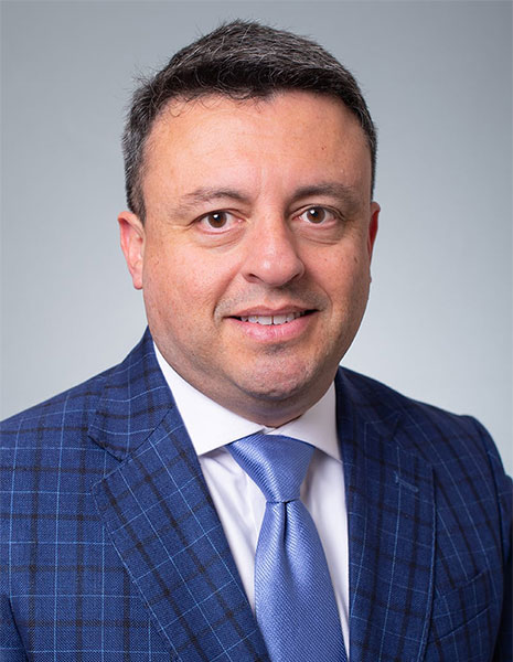 Augusto Antonio Robles - Headshot of man in professional attire