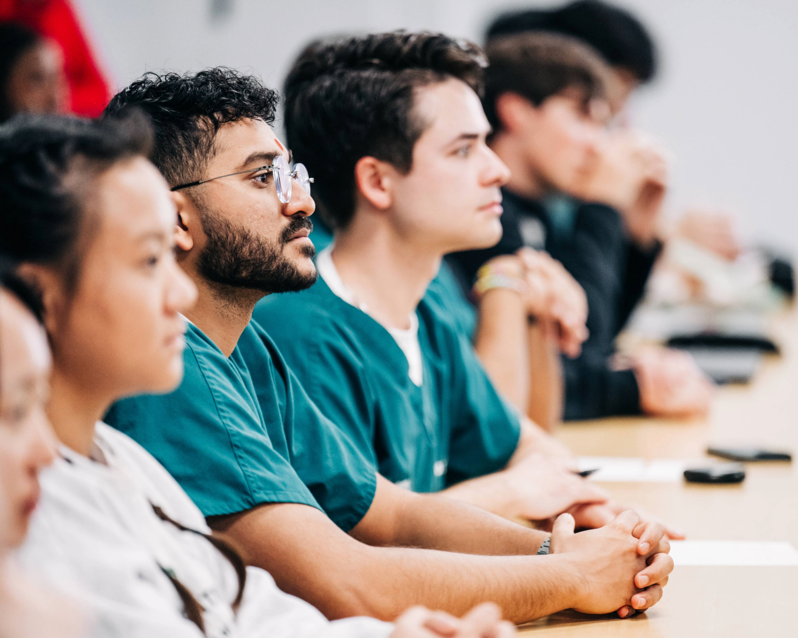 Dental student looking focused in a classroom