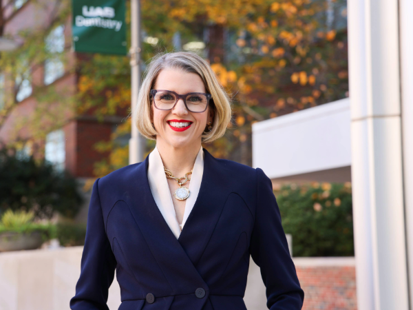 Dr. Geisinger in front of the UAB School of Dentistry