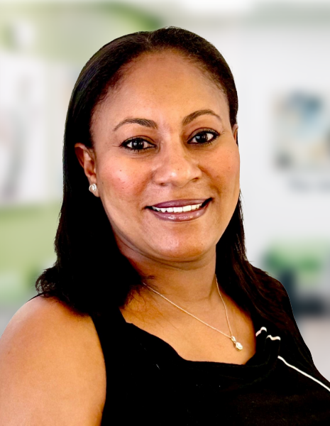 Woman with dark hair and black top smiling for headshot