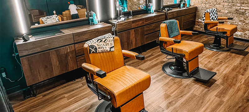 Photo of the interior of an upscale barber shop