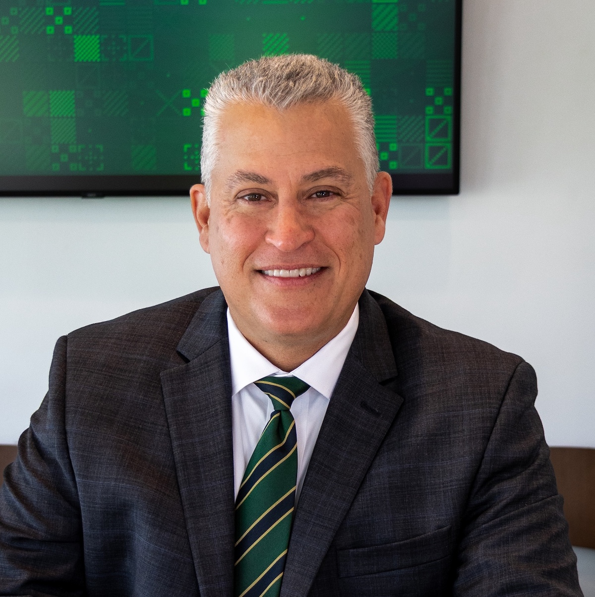 Portrait of Robert Howard sitting at his desk