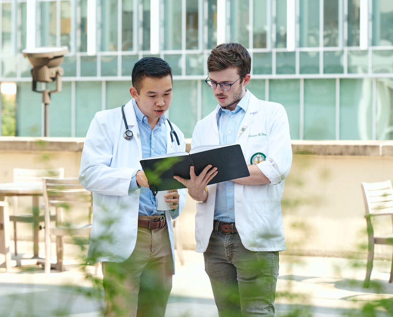 medical student shaking hands with patient