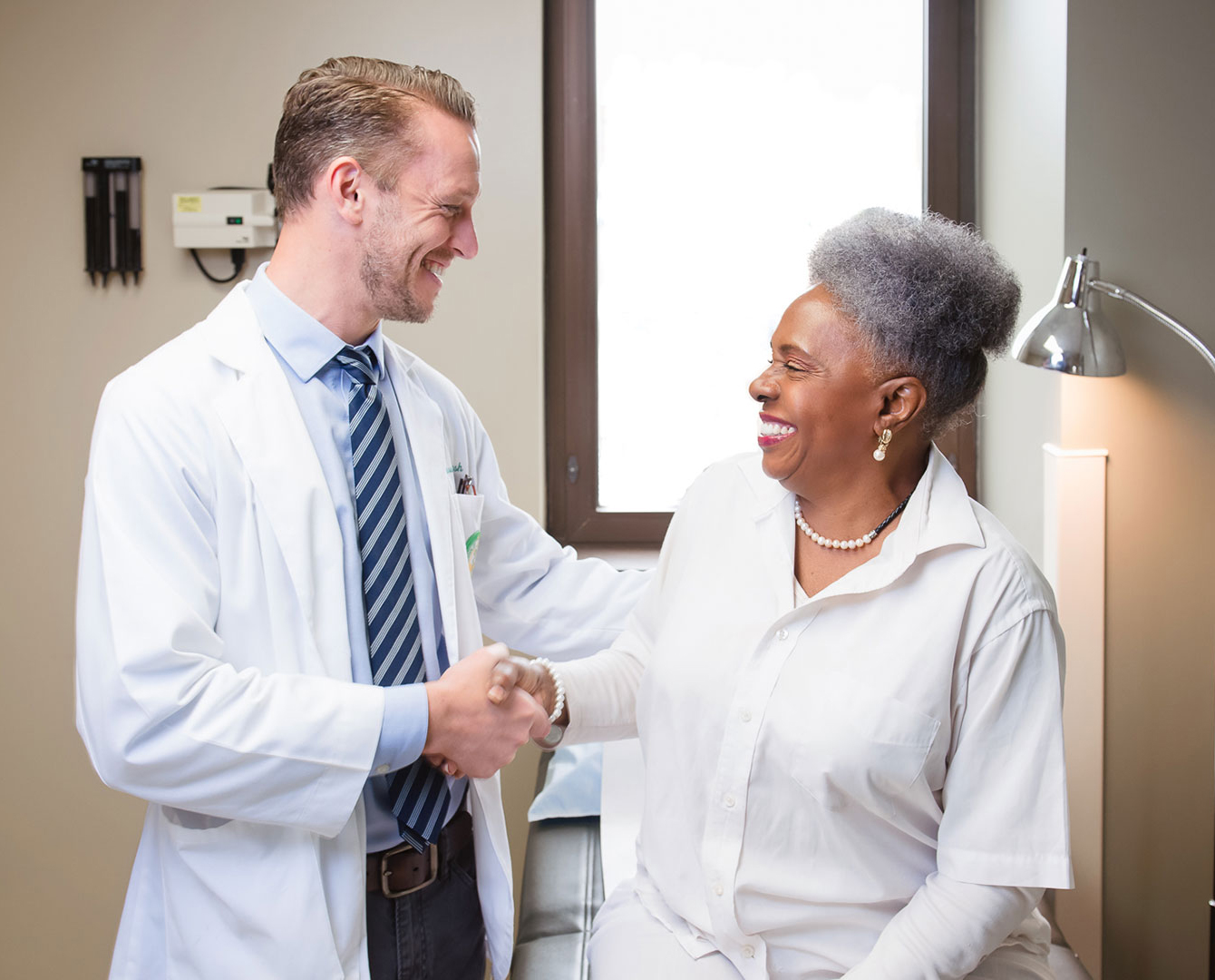 medical student shaking hands with patient 2