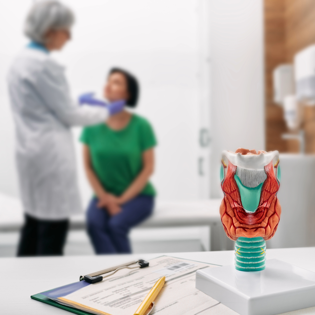 Doctor performing thyroid exam