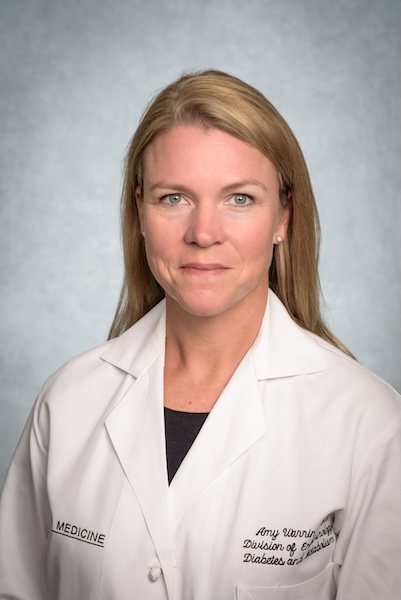 Headshot of Dr. Amy Warriner, MD (Professor, Endocrinology, Diabetes, and Metabolism) in white medical coat, September 2023.