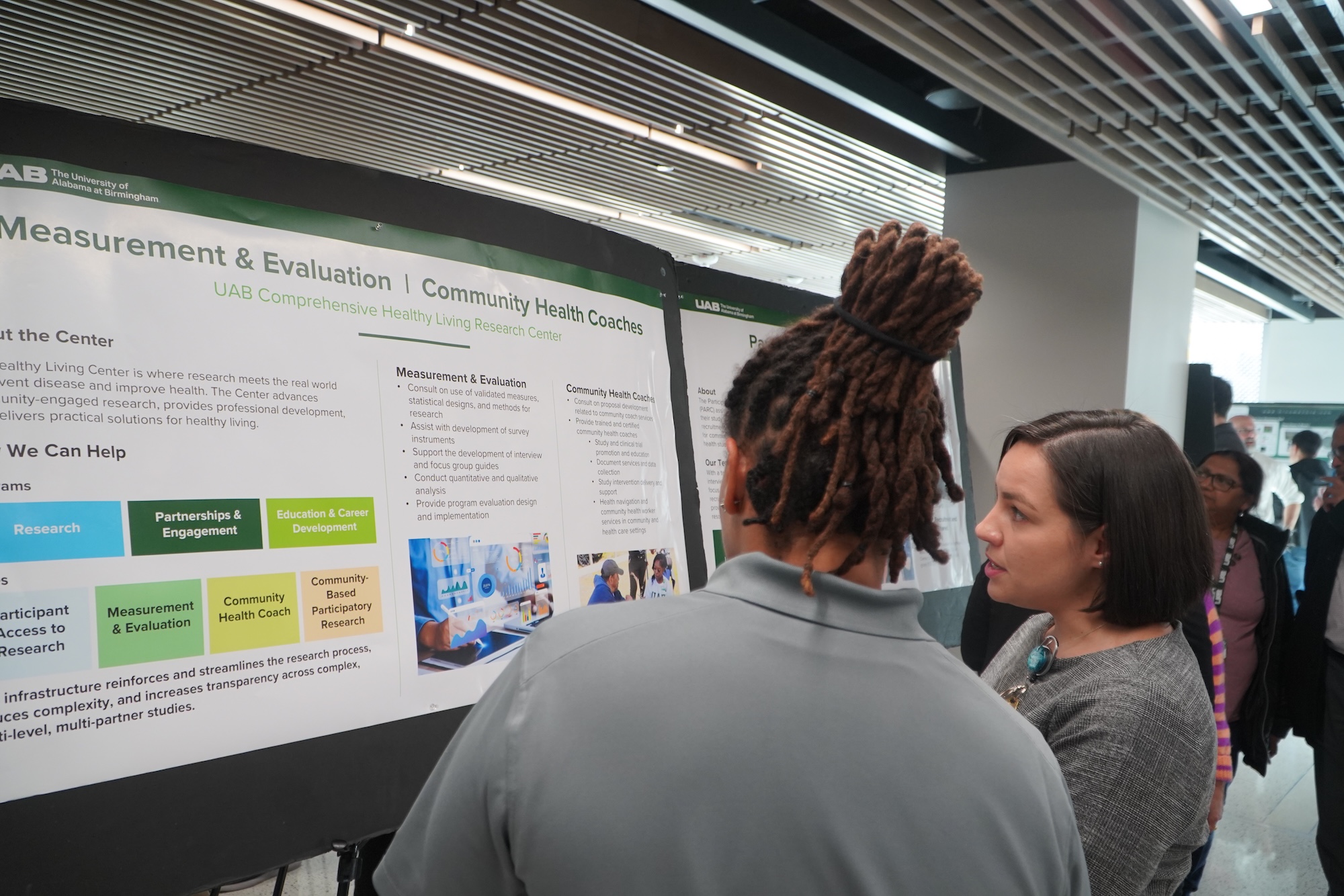 Healthy Living Research Center staff explaining the Research Program's services