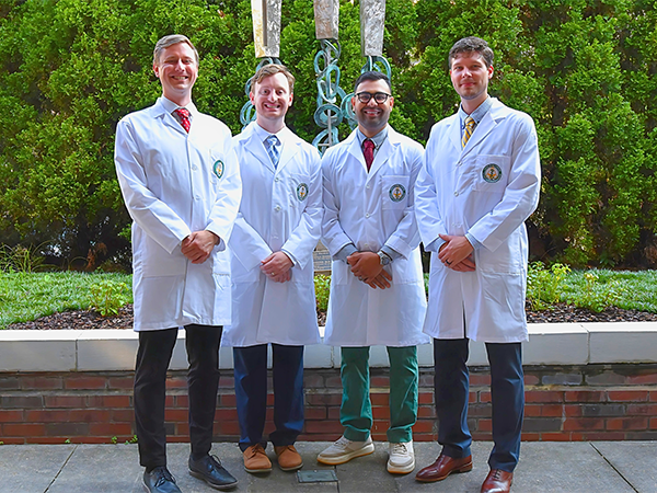 Dept. of PM&R PGY4 residents standing outside of Spain Rehabilitation Center