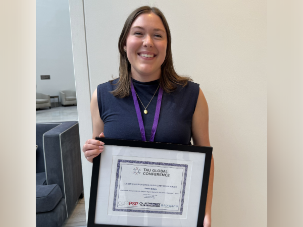 Image of Emma Hobby holding award