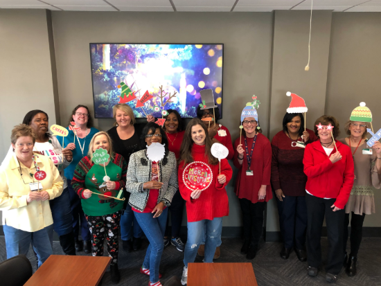 Michelle Thrasher and UAB Otolaryngology staff in holiday attire
