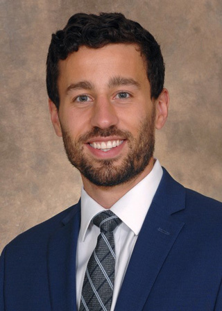 Headshot of Dr. Buchan.