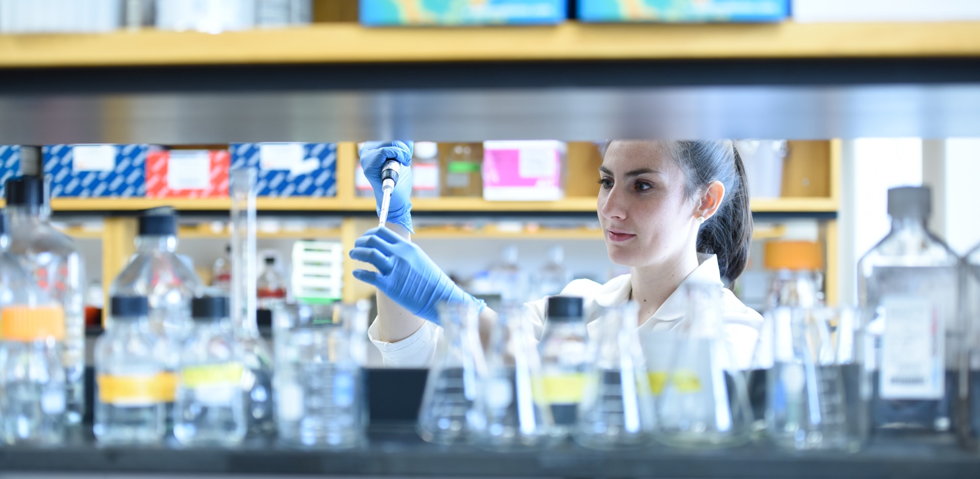 researcher using lab equipment