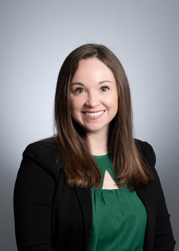 Headshot of Dr. Stephanie Wilson in green top and black jacket.