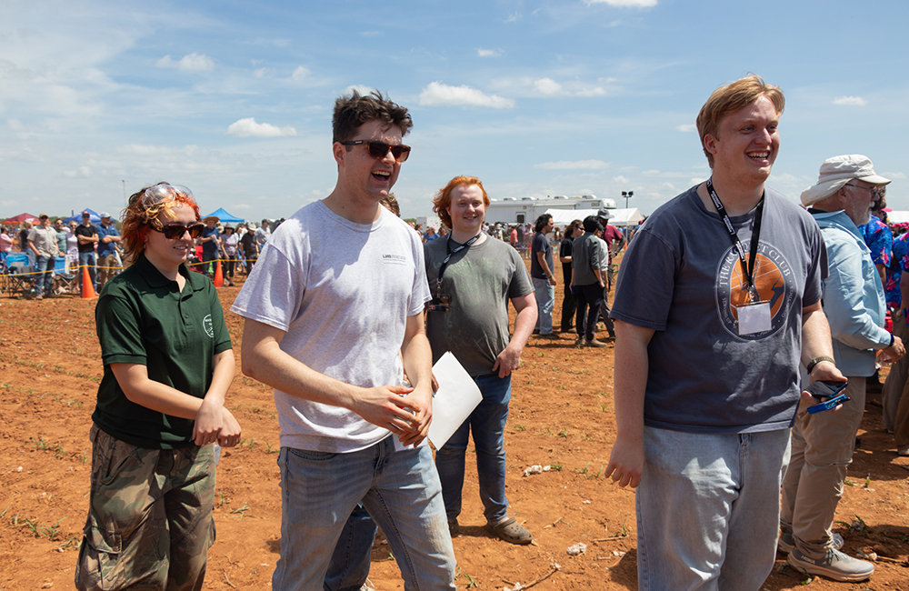 Rocketry Club members are all smiles after the successful launch and landing