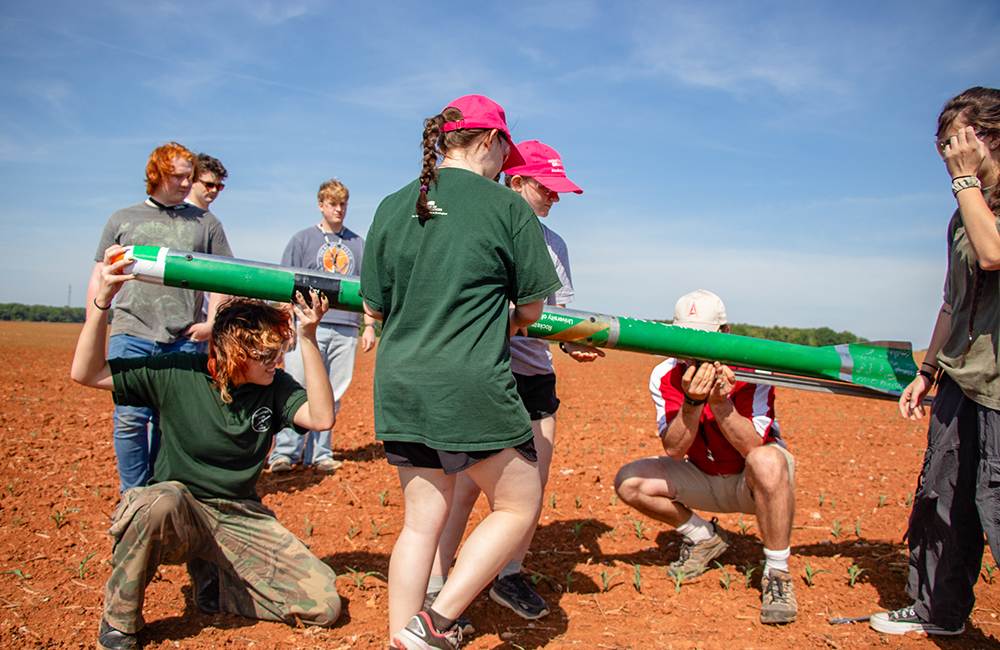 Members of the Rocketry Club at UAB loading Vulcan I onto the launching rail