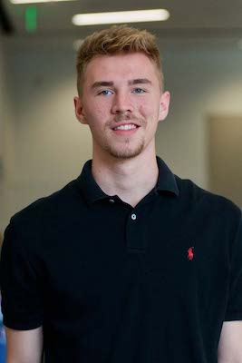 Stephen Lanzi wearing a dark polo shirt. 