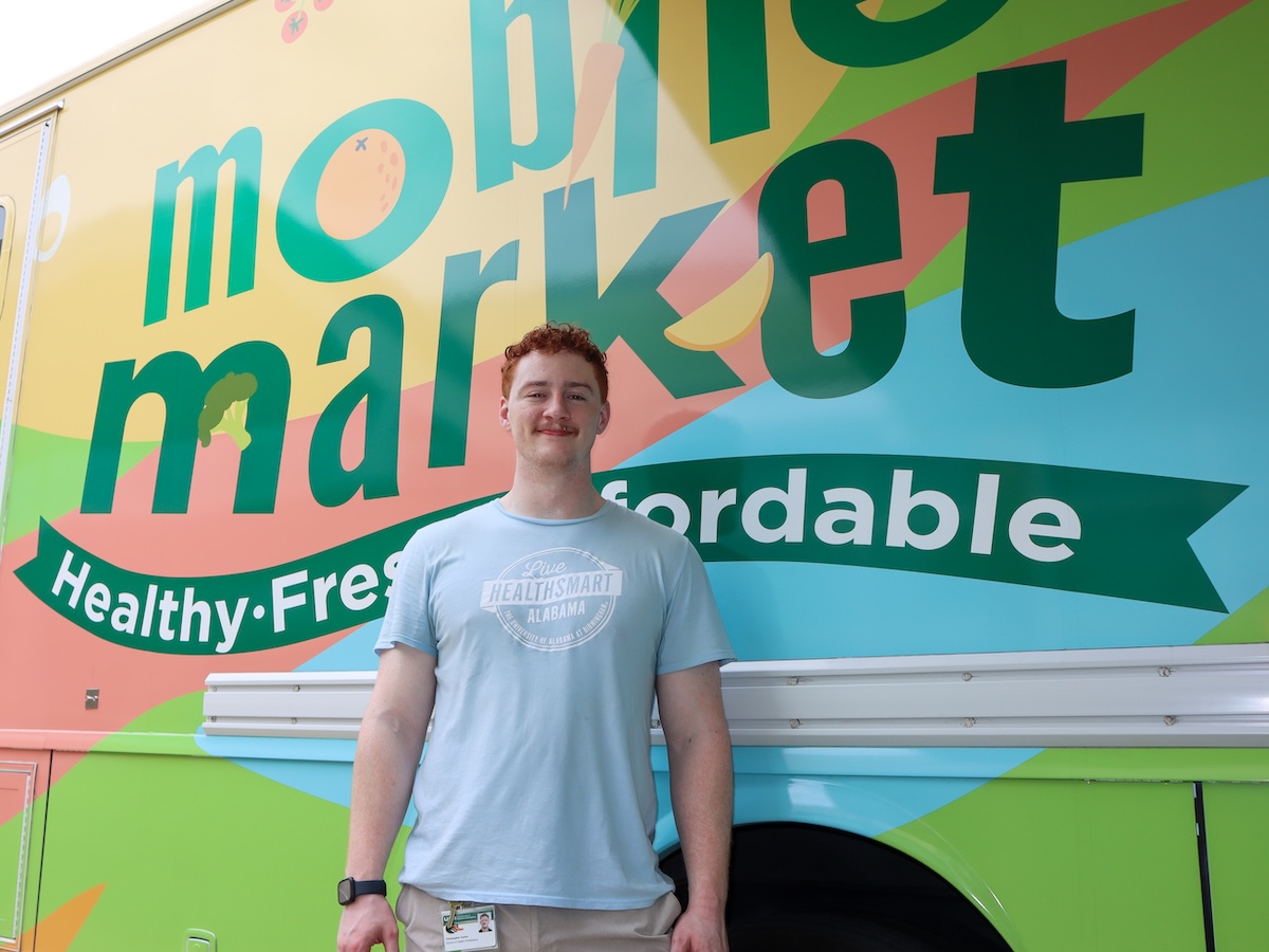 Chris Colvin posed in front of LHSA Mobile Market