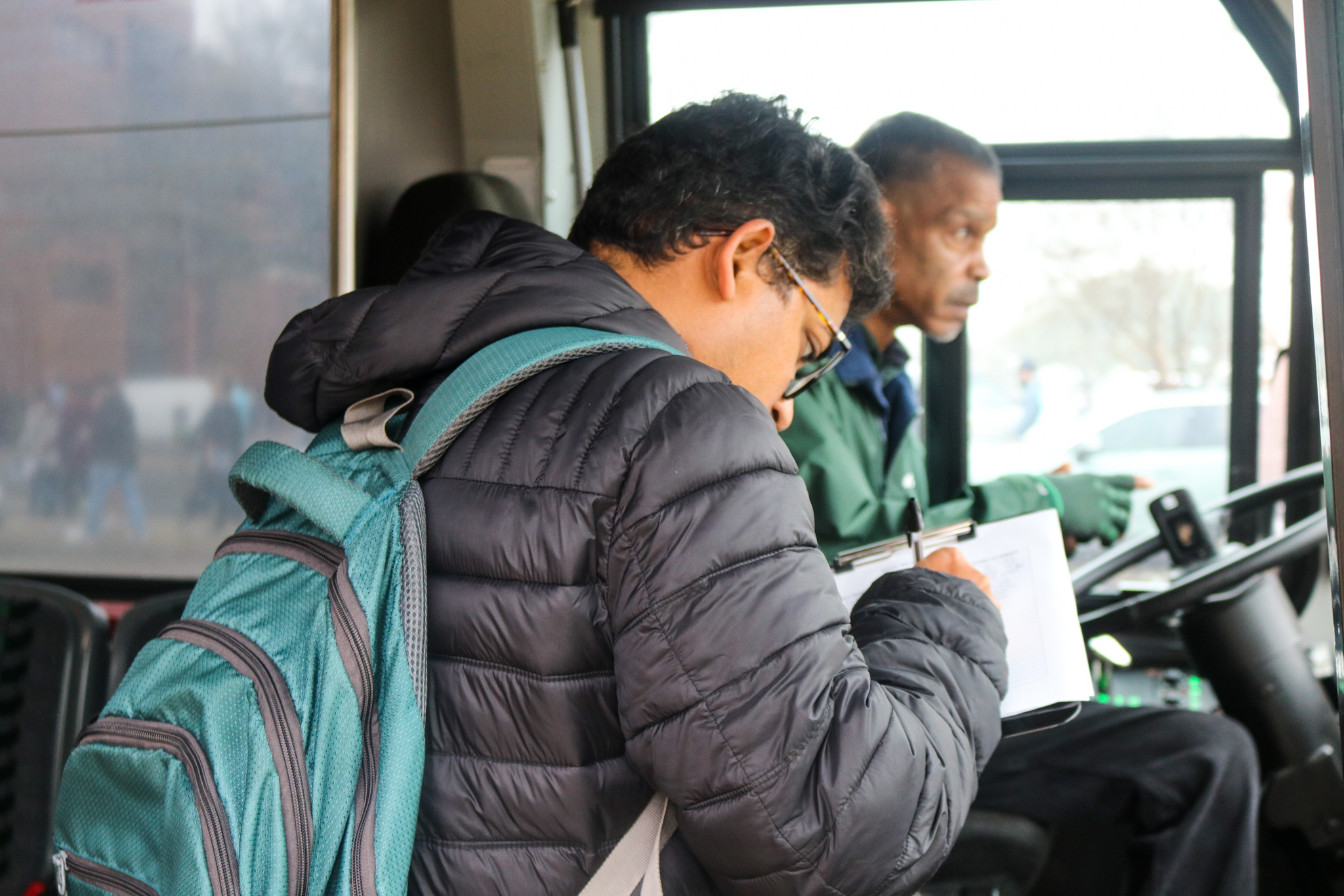 UAB student checking in before boarding the Blazer Express as part of the Blazer Market Route